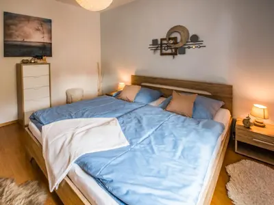 Ein Bett oder Betten in einem Zimmer der Unterkunft Ferienwohnung am Weissen Hirsch