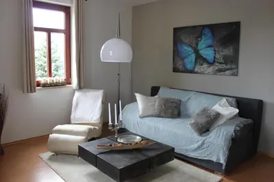 Ein Sitzbereich in der Unterkunft Ferienwohnung am Weissen Hirsch