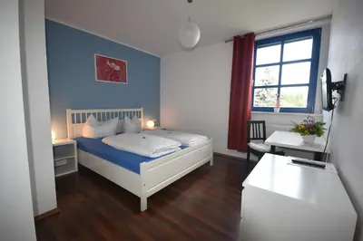 Ein Bett oder Betten in einem Zimmer der Unterkunft Beerenvilla