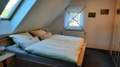 Ein Bett oder Betten in einem Zimmer der Unterkunft Ferienwohnung Renner