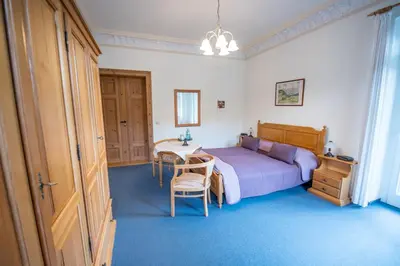 Ein Bett oder Betten in einem Zimmer der Unterkunft Bilz-Pension