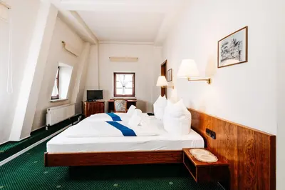 Ein Bett oder Betten in einem Zimmer der Unterkunft Hotel Brander Hof