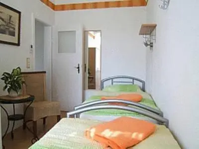 Ein Bett oder Betten in einem Zimmer der Unterkunft Ferienwohnung 