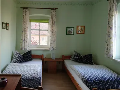 Ein Bett oder Betten in einem Zimmer der Unterkunft Alte Käserei Kössern
