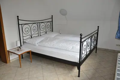 Ein Bett oder Betten in einem Zimmer der Unterkunft Ferienhaus Weber