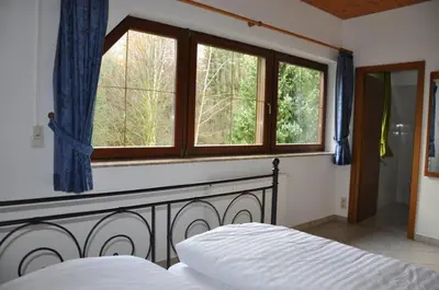 Ein Bett oder Betten in einem Zimmer der Unterkunft Ferienhaus Weber