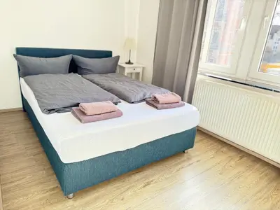 Ein Bett oder Betten in einem Zimmer der Unterkunft Pension Dresdener Berge