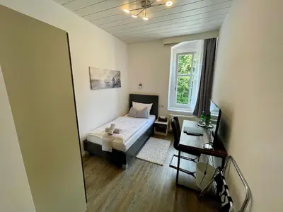 Ein Bett oder Betten in einem Zimmer der Unterkunft Waldhaus Pulsnitz