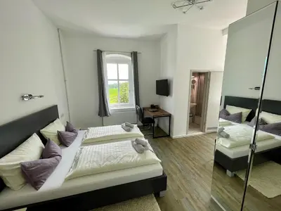 Ein Bett oder Betten in einem Zimmer der Unterkunft Waldhaus Pulsnitz