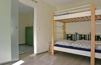 Ein Bett oder Betten in einem Zimmer der Unterkunft Kleines Häuschen - Ferien in Cossebaude