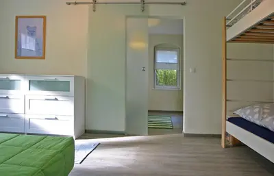Ein Bett oder Betten in einem Zimmer der Unterkunft Kleines Häuschen - Ferien in Cossebaude