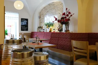 Ein Sitzbereich in der Unterkunft Hotel Arcus