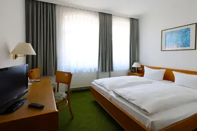 Ein Bett oder Betten in einem Zimmer der Unterkunft Hotel Arcus