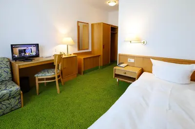 Ein Bett oder Betten in einem Zimmer der Unterkunft Hotel Arcus