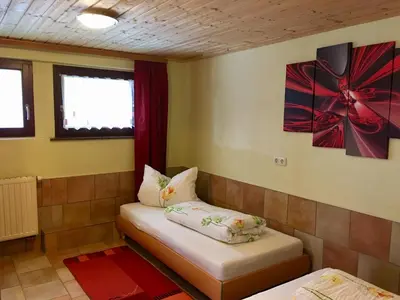 Ein Bett oder Betten in einem Zimmer der Unterkunft Ferienwohnung Am Grünbach 1