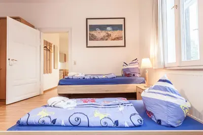 Ein Bett oder Betten in einem Zimmer der Unterkunft Gästehaus Villa Rose
