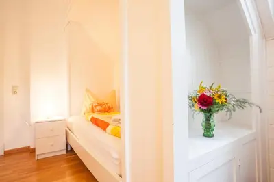Ein Bett oder Betten in einem Zimmer der Unterkunft Gästehaus Villa Rose
