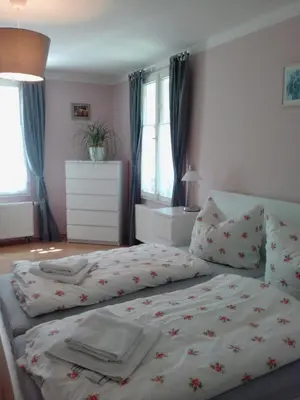 Ein Bett oder Betten in einem Zimmer der Unterkunft Gästehaus Villa Rose