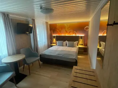 Ein Bett oder Betten in einem Zimmer der Unterkunft Hotel 