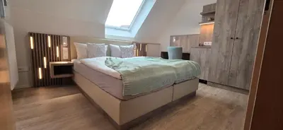 Ein Bett oder Betten in einem Zimmer der Unterkunft Hotel 