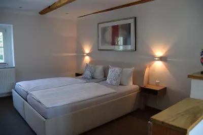 Ein Bett oder Betten in einem Zimmer der Unterkunft Hotel 