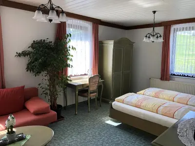 Ein Bett oder Betten in einem Zimmer der Unterkunft Pension Bennelliebschänke