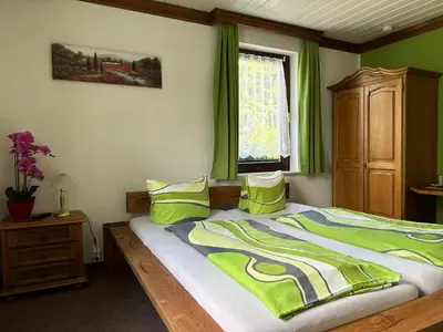 Ein Bett oder Betten in einem Zimmer der Unterkunft Pension Bennelliebschänke