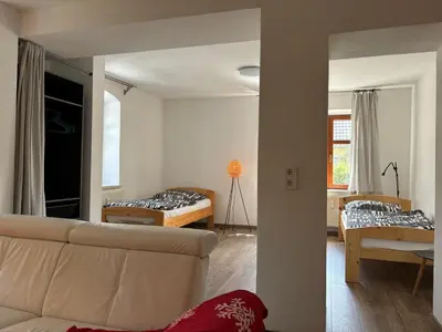 Ein Bett oder Betten in einem Zimmer der Unterkunft Ferienwohnung Doberschau