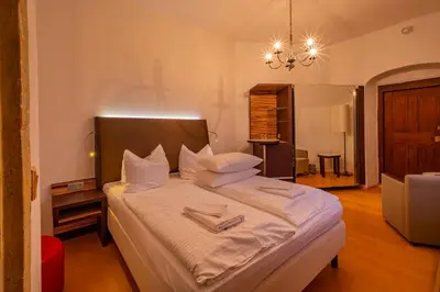 Ein Bett oder Betten in einem Zimmer der Unterkunft Wasserschloss Podelwitz