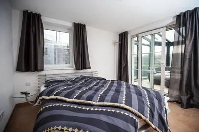 Ein Bett oder Betten in einem Zimmer der Unterkunft Weinberghaus Prossen, Haus mit Sauna und Whirlpool für maximal 8 Personen