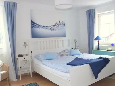 Ein Bett oder Betten in einem Zimmer der Unterkunft Exklusive Ferienwohnung an der Elbe