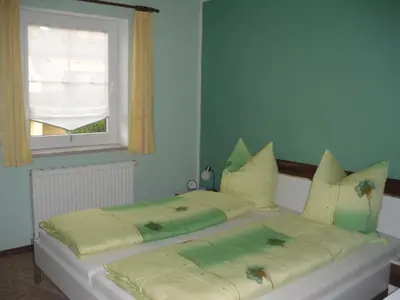 Ein Bett oder Betten in einem Zimmer der Unterkunft Ferienwohnung Rothe