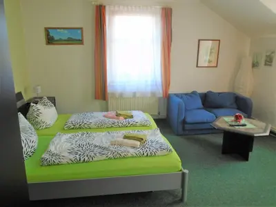 Ein Bett oder Betten in einem Zimmer der Unterkunft Erbgericht
