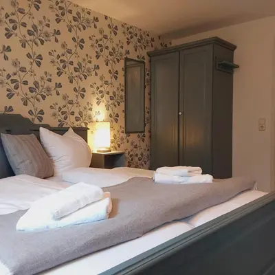 Ein Bett oder Betten in einem Zimmer der Unterkunft Bed and Breakfast Wehlen