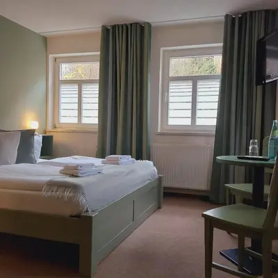 Ein Bett oder Betten in einem Zimmer der Unterkunft Bed and Breakfast Wehlen
