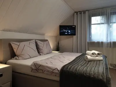 Ein Bett oder Betten in einem Zimmer der Unterkunft Scholz & Scholz GbR Zimmervermietung