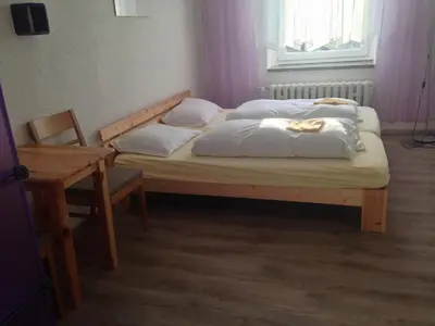 Ein Bett oder Betten in einem Zimmer der Unterkunft Hostel im Osterzgebirge