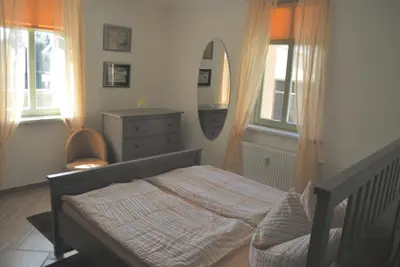 Ein Bett oder Betten in einem Zimmer der Unterkunft Ferienwohnung am Schloss Rochlitz