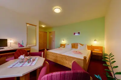 Ein Bett oder Betten in einem Zimmer der Unterkunft Hotel Dachsbaude & Kammbaude