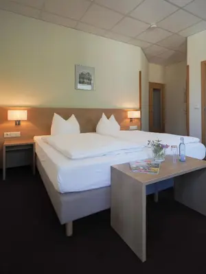 Ein Bett oder Betten in einem Zimmer der Unterkunft Gasthof Hillig