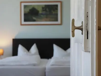 Ein Bett oder Betten in einem Zimmer der Unterkunft Gasthof Hillig