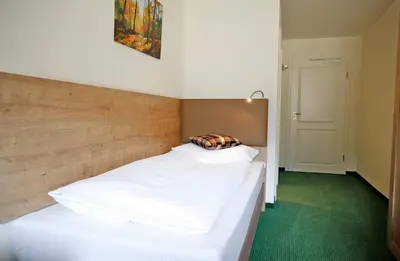 Ein Bett oder Betten in einem Zimmer der Unterkunft Gasthof Hillig
