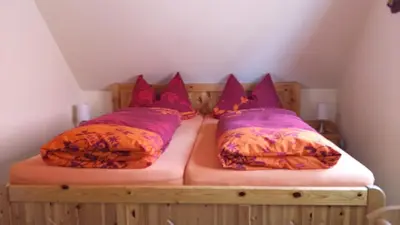 Ein Bett oder Betten in einem Zimmer der Unterkunft Ferienhaus Knappensee