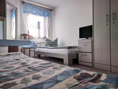 Ein Bett oder Betten in einem Zimmer der Unterkunft Ferienwohnung mit Terrasse