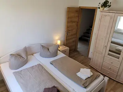Ein Bett oder Betten in einem Zimmer der Unterkunft Ferienhaus Papstdorf Sächsische Schweiz 18