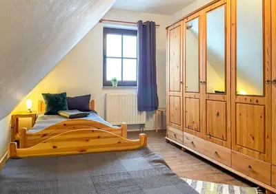 Ein Bett oder Betten in einem Zimmer der Unterkunft FeWoMaurer WG1 Dachgeschoss