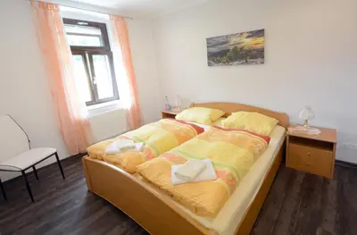 Ein Bett oder Betten in einem Zimmer der Unterkunft Ferienwohnung Villa AusZeit