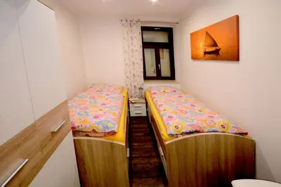 Ein Bett oder Betten in einem Zimmer der Unterkunft Ferienwohnung Villa AusZeit