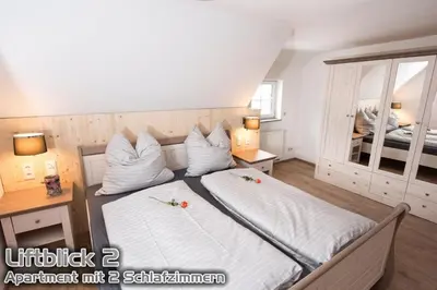 Ein Bett oder Betten in einem Zimmer der Unterkunft Ferienwohnungen 