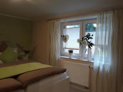 Ein Bett oder Betten in einem Zimmer der Unterkunft SeidelsFerienparadiesGahlenz